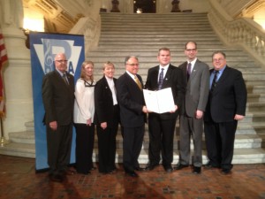 While in Harrisburg, PMEA received a resolution from the Pennsylvania House designating March as Music In Our Schools Month. The resolution also recognized the work of music educators in Pennsylvania. Pictured here are: Chuck Neidhardt, a PMEA Past President; Abi Young, PMEA Assistant Executive Director; Margaret Bauer, PMEA Executive Director; Representative Eddie Day Pashinski; Dennis Emert, PMEA President; Mark Despotakis, PMEA Advancement of Music Education Council Chair and Representative Tim Briggs.